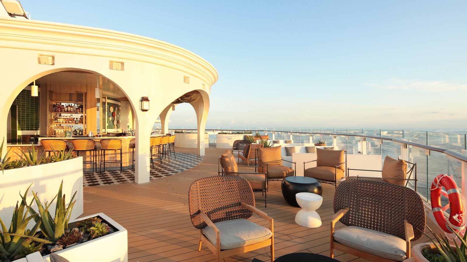 Image may contain Chair Furniture Architecture Balcony Building Terrace Lamp and Plant