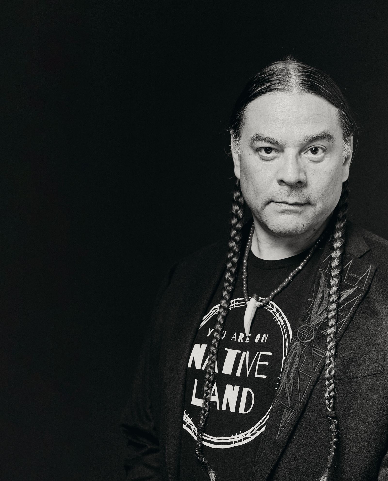 Image may contain Face Head Person Photography Portrait Accessories Jewelry Necklace Adult Braid and Hair