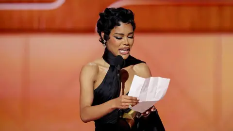 Getty Images Actress Teyana Taylor reads her acceptance speech onstage at the 83rd Golden Globes