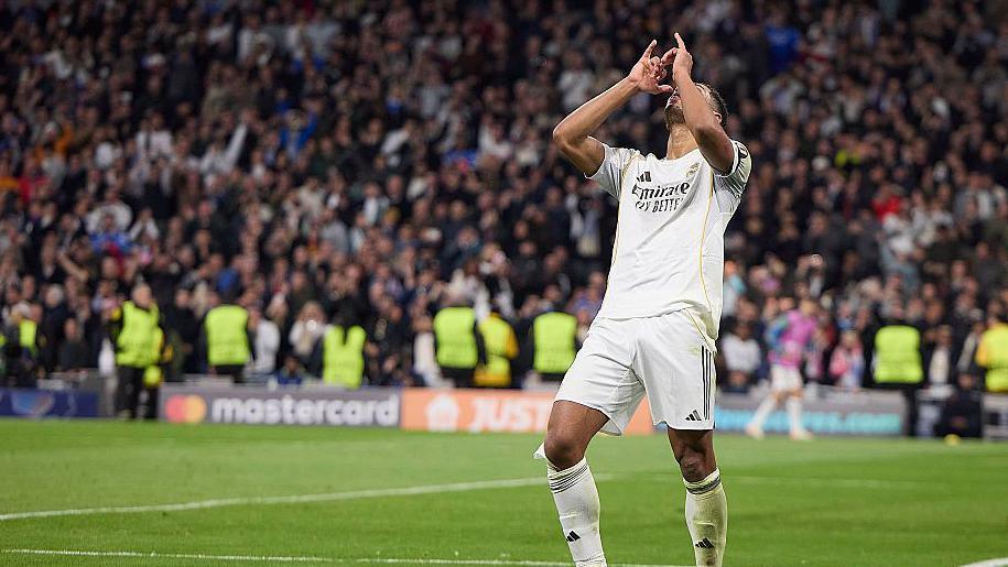 Bellingham celebrates a goal with a drinking gesture