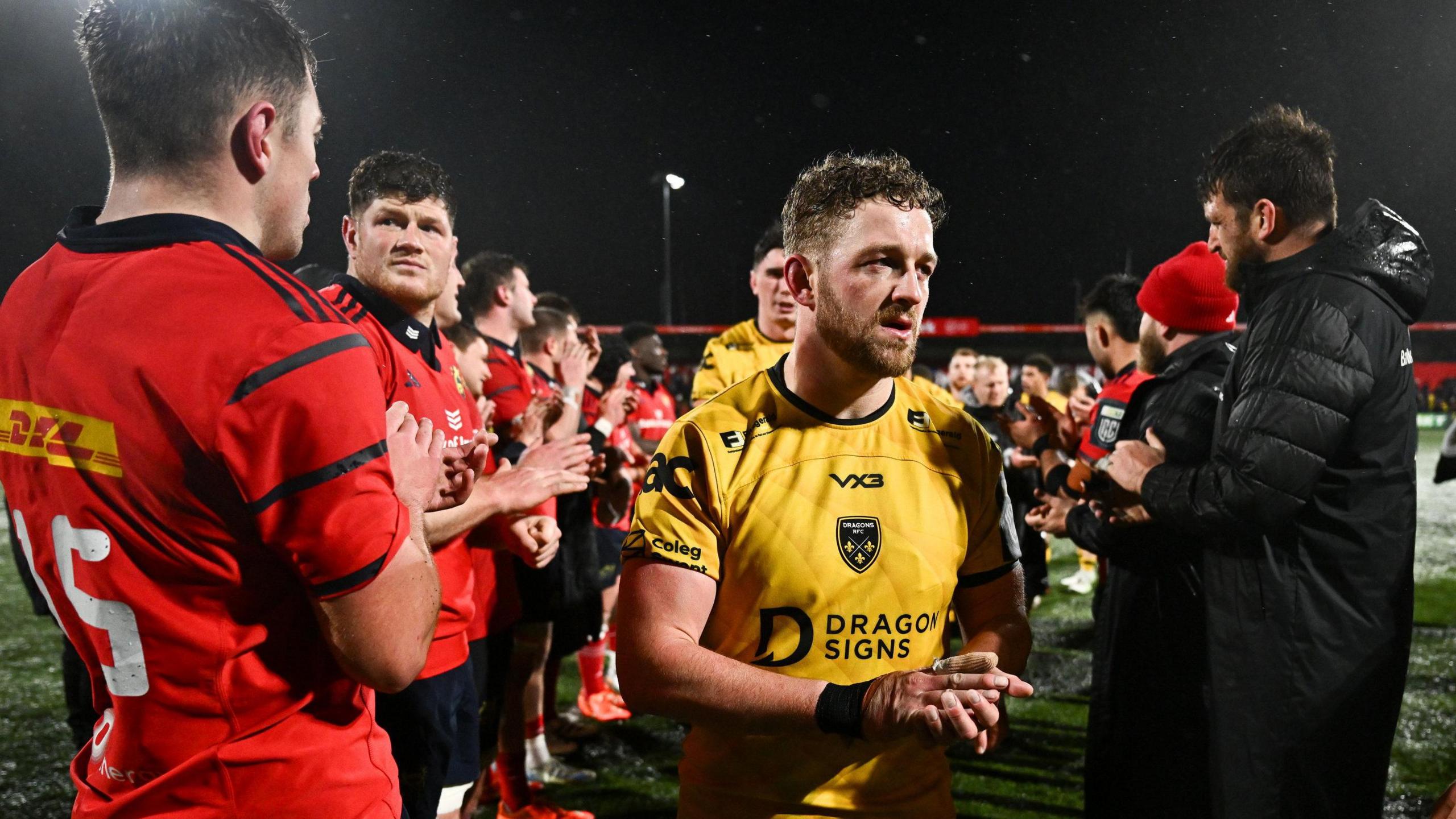 Angus O'Brien claps Munster players after a narrow Dragons defeat