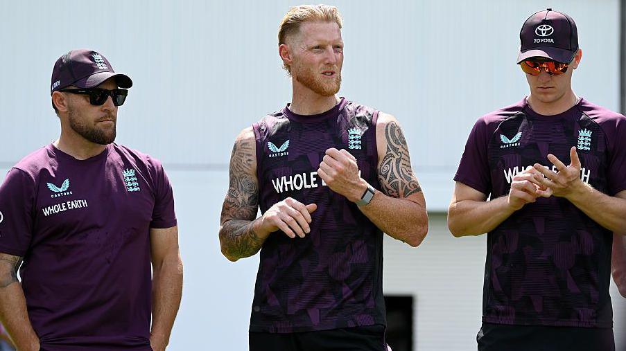 England captain Ben Stokes speaks to the team alongside coach Brendon McCullum and Harry Brook during a net session at Edgbaston in June