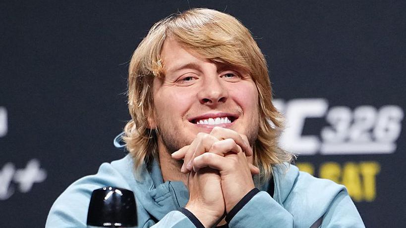 Paddy Pimblett grins during a news conference