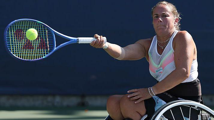 Lucy Shuker playing tennis on a sunny day