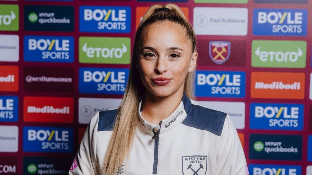 West Ham's Ria Bose poses in signing promo