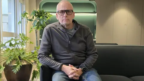 Phil Jones, a leaseholder sat in his flat in Westcliff-on-Sea