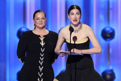 Getty Images Melissa McCarthy and Kathryn Hahn speak onstage during the 83rd Annual Golden Globe Awards at The Beverly Hilton on January 11, 2026 in Beverly Hills, California.