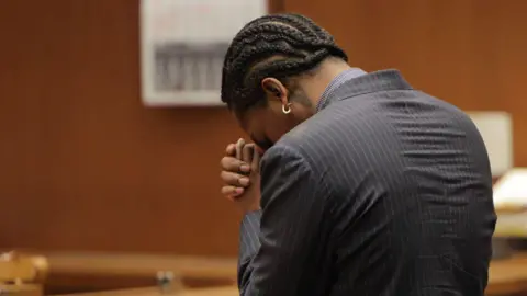 Getty Images A$AP Rocky reacts in court as the verdict is given in his felony assault trial.