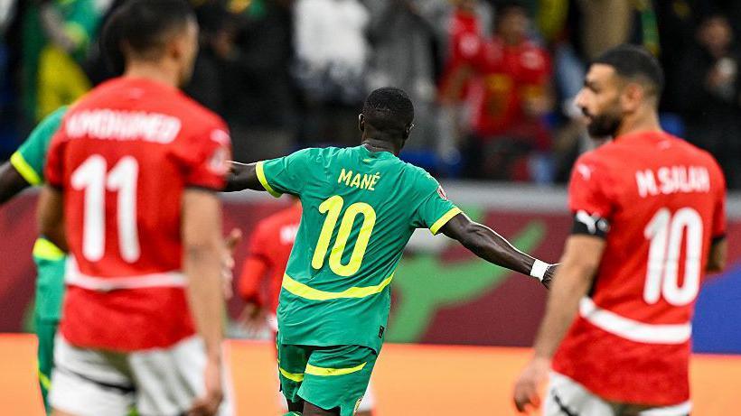 Sadio Mane celebrates scoring against Egypt