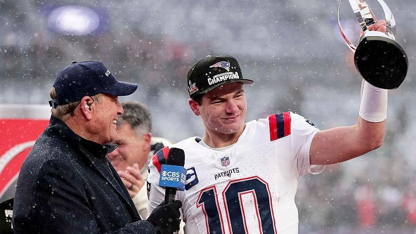 Drake Maye holds aloft the AFC Championship trophy after the New England Patriots beat the Denver Broncos