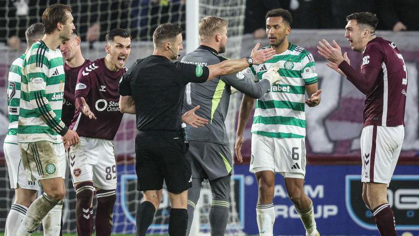 Referee Steven McLean initially showed Celtic's Auston Trusty a yellow card before VAR intervened