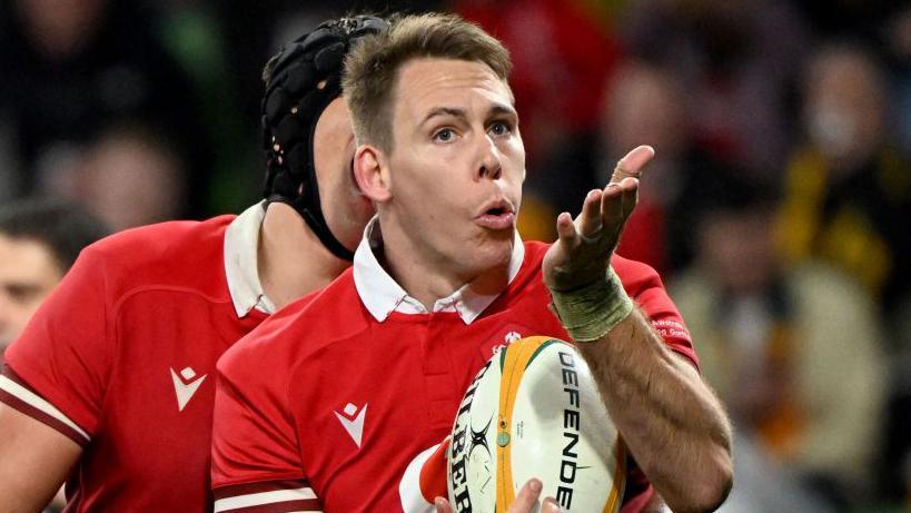 Wales' Liam Williams blows a kiss to the crowd after scoring a try during the second Test in Australia in 2024