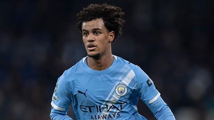 Oscar Bobb in a Manchester City home kit