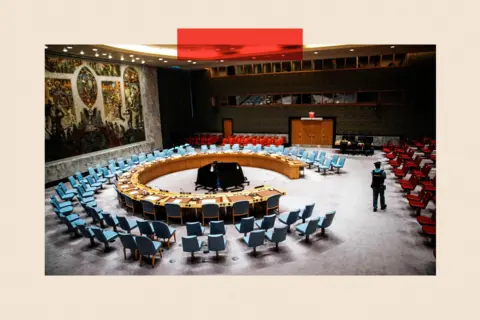 Reuters A UN security officer stands guard at the Security Council Chamber ahead of a UN Security Council vote on a draft resolution demanding a ceasefire in Gaza, in September 2025