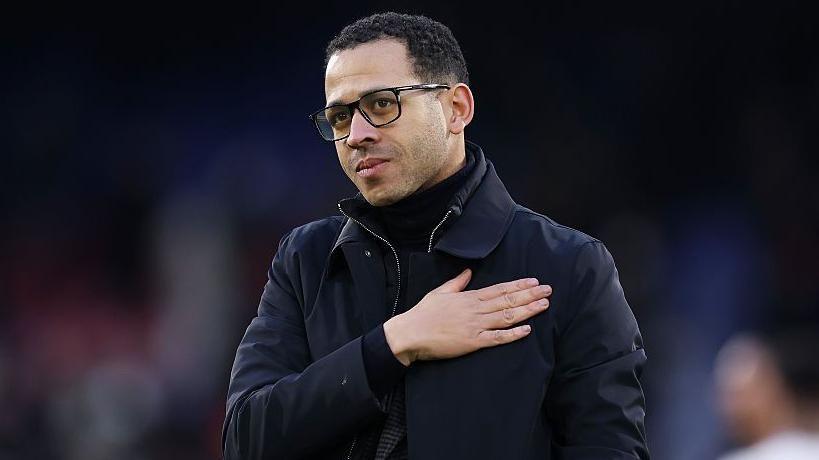Liam Rosenior puts hand on his chest when approaching Chelsea's away supporters at Crystal Palace