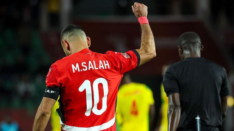 Salah celebrates after scoring