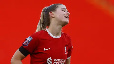 Reuters Liverpool's Marie Hobinger looks dejected on the pitch.