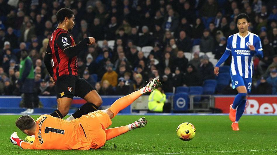 Bournemouth's Amine Adli goes down under the challenge of Bart Verbruggen