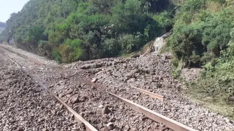 RAIB Rubble that has come down a slope and onto traintracks.