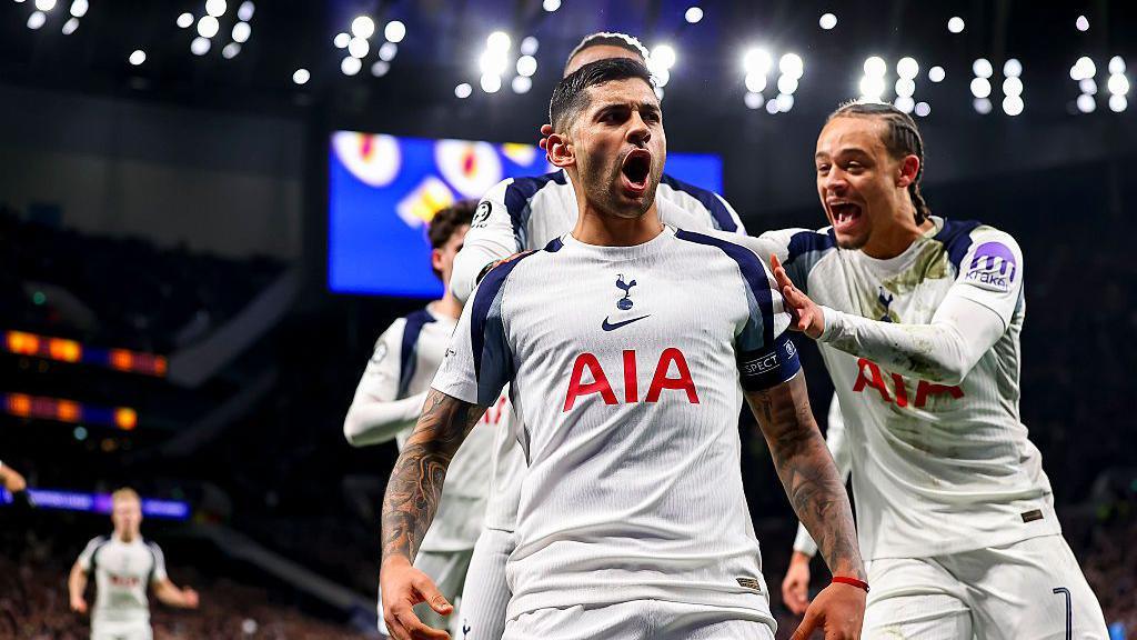 Cristian Romero celebrates with Tottenham players