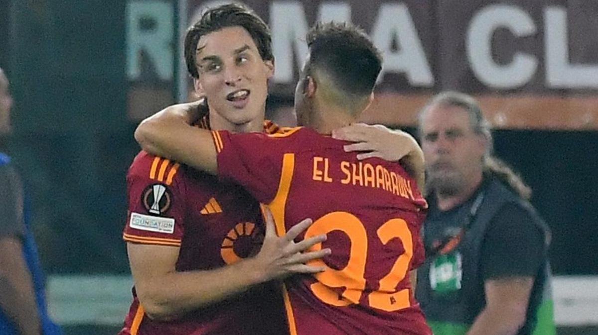 Edoardo Bove is hugged by a Roma team-mate after scoring a goal