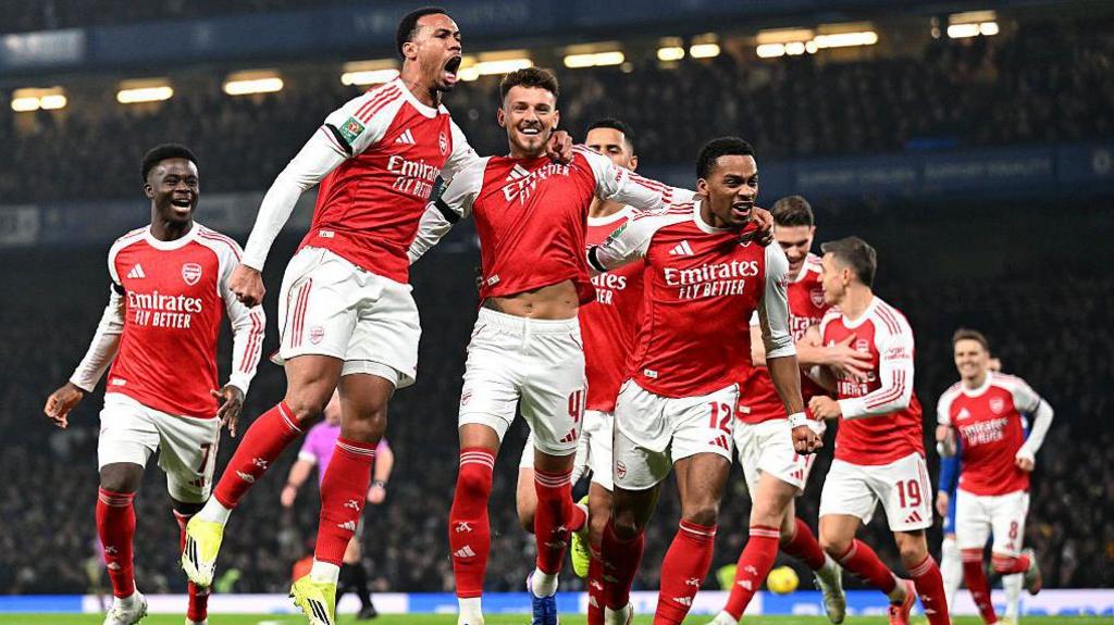 Arsenal players celebrate their goal
