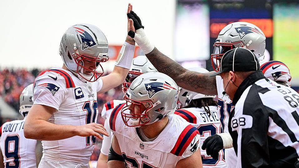 New England Patriots quarterback Drake Maye celebrates after scoring a touchdown against the Denver Broncos in the AFC Championship game in 2026