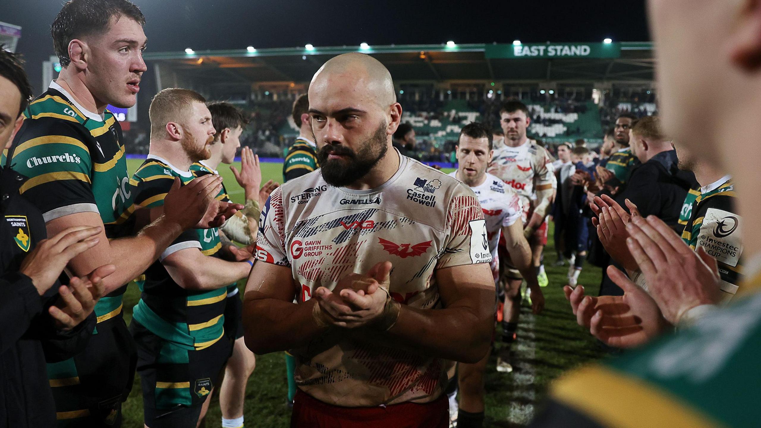 Josh Macleod leads Scarlets off the field after their Champions Cup defeat at Northampton