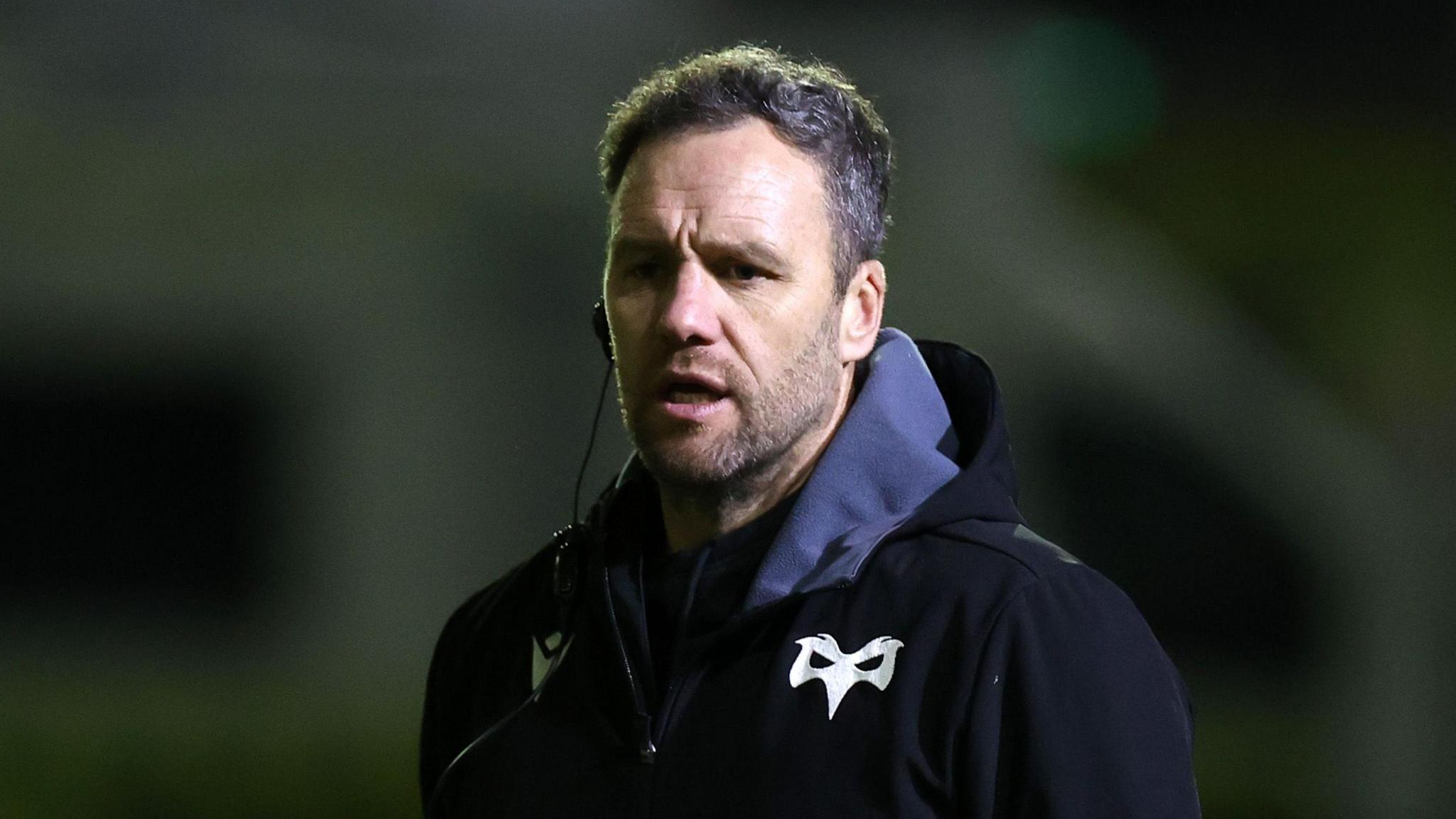 Head coach Mark Jones watches Ospreys warm up before their game against Montpellier