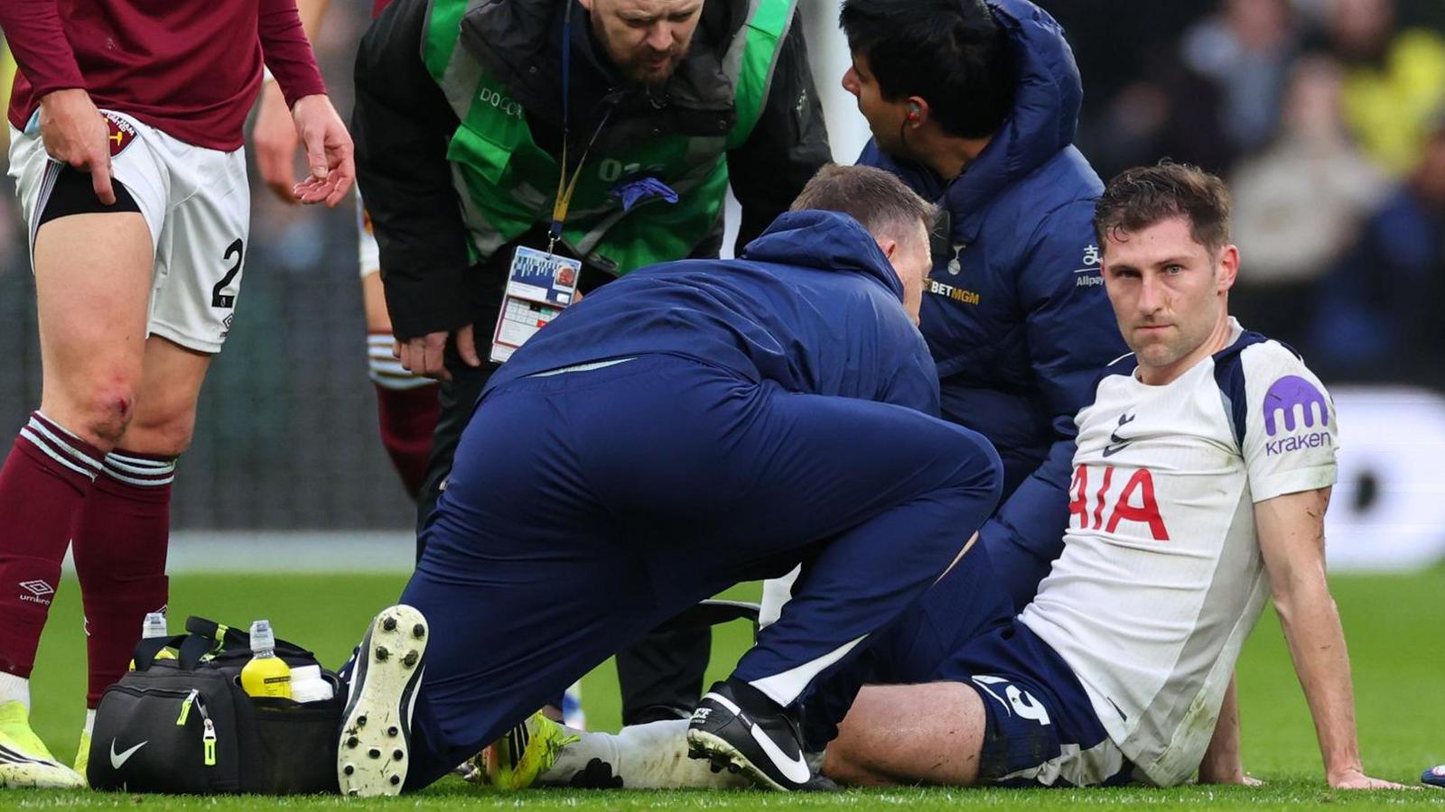 Tottenham defender Ben Davies receives treatment before going off on a stretcher against West Ham
