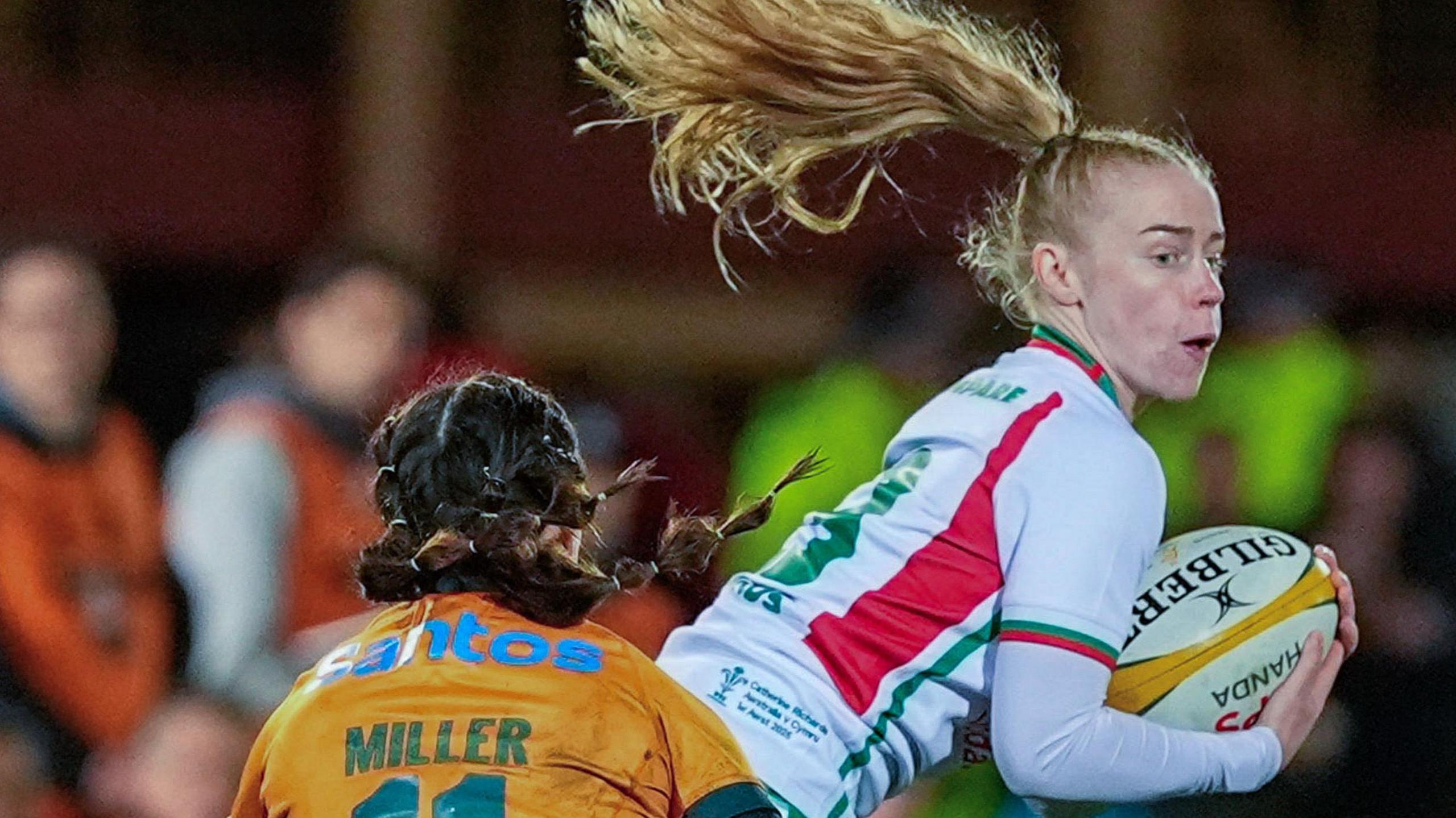 Catherine Richards catches the ball playing for Wales against Australia in Sydney