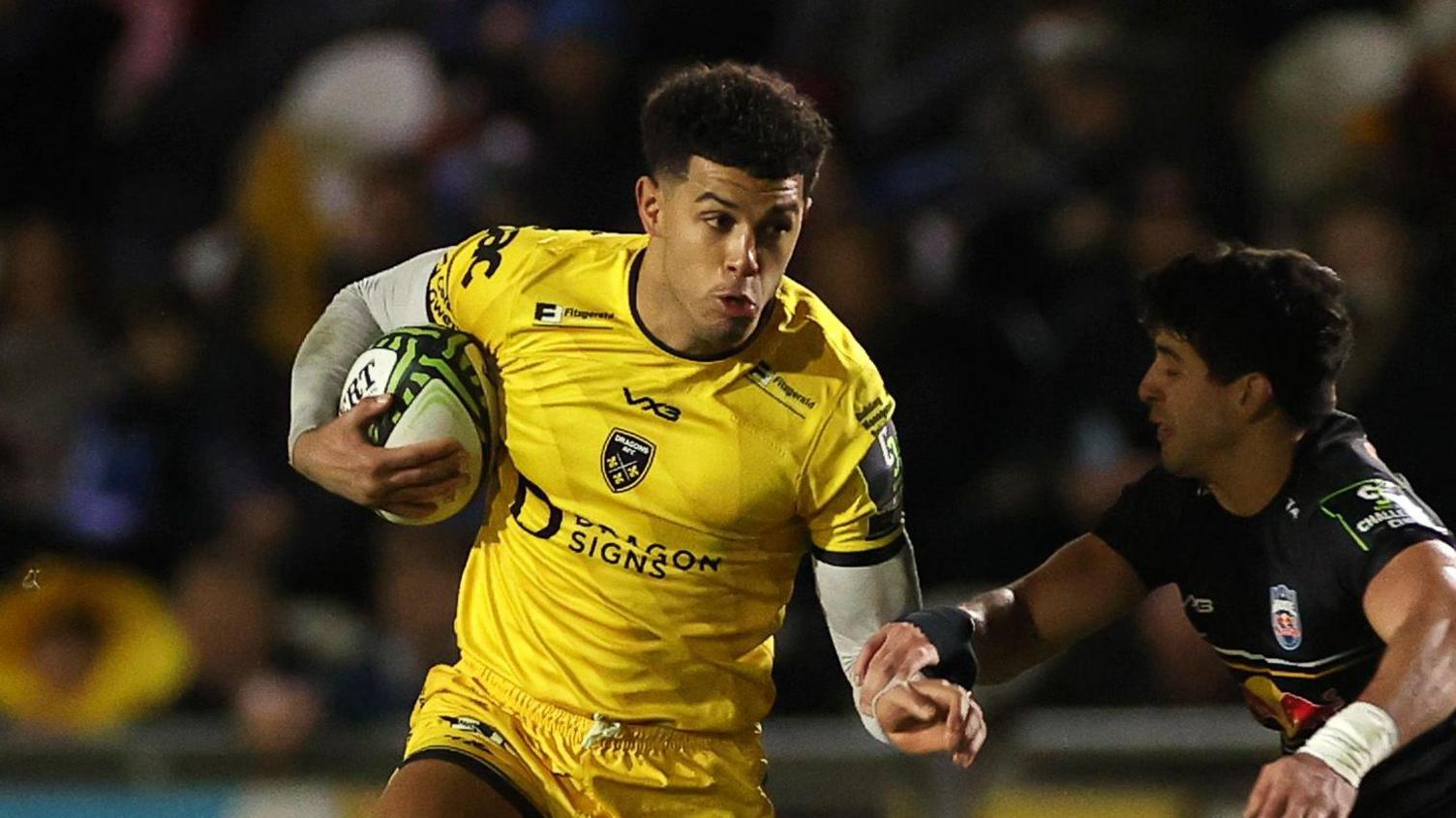 Rio Dyer dives to score a try for Dragons against Newcastle