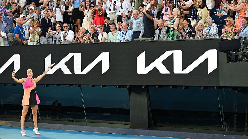 Aryna Sabalenka takes a selfie with the crowd