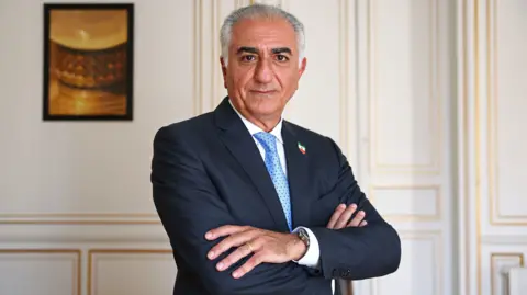 Reuters Reza Pahlavi, the exiled son of the last Shah of Iran, poses after an interview with Reuters about the situation in Iran and the need to support Iranians, in Paris, France, June 23, 2025