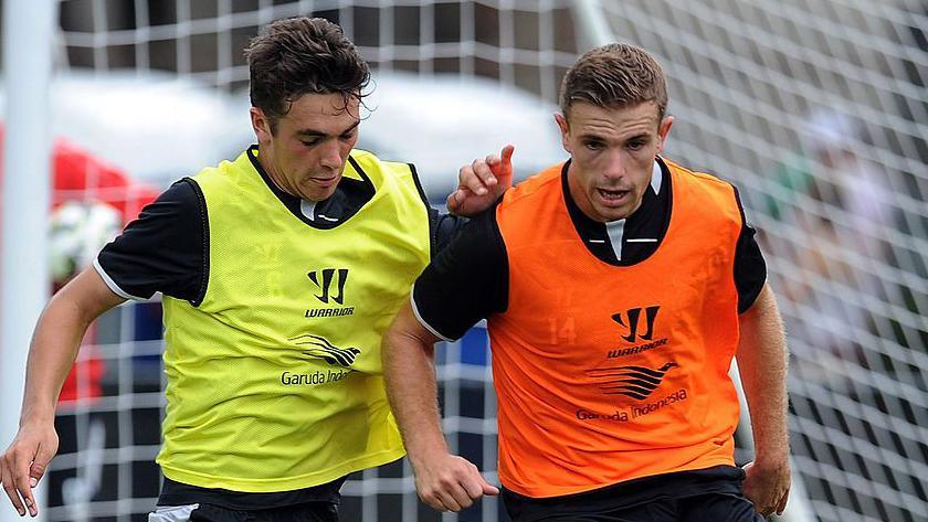 Adam Phillips and Jordan Henderson of Liverpool in action during a training session at Harvard University in July 2014