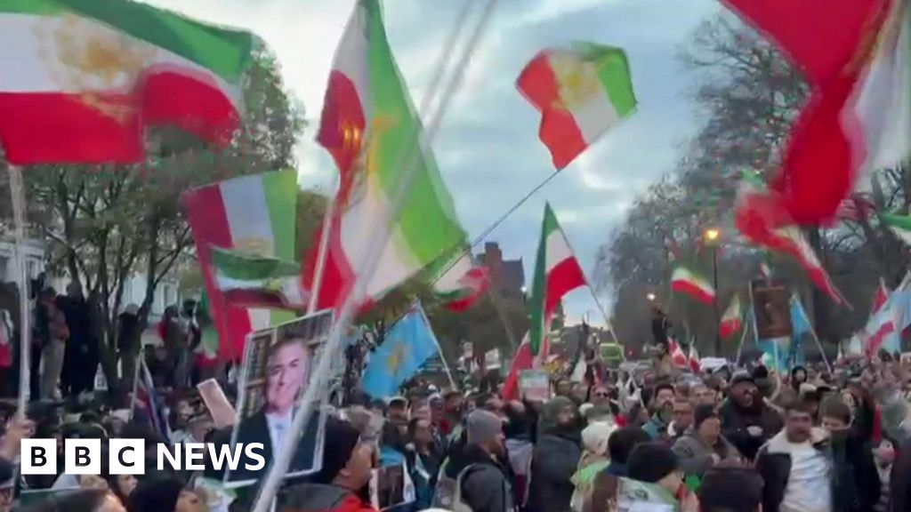 Protester climbs onto balcony of Iranian embassy in London