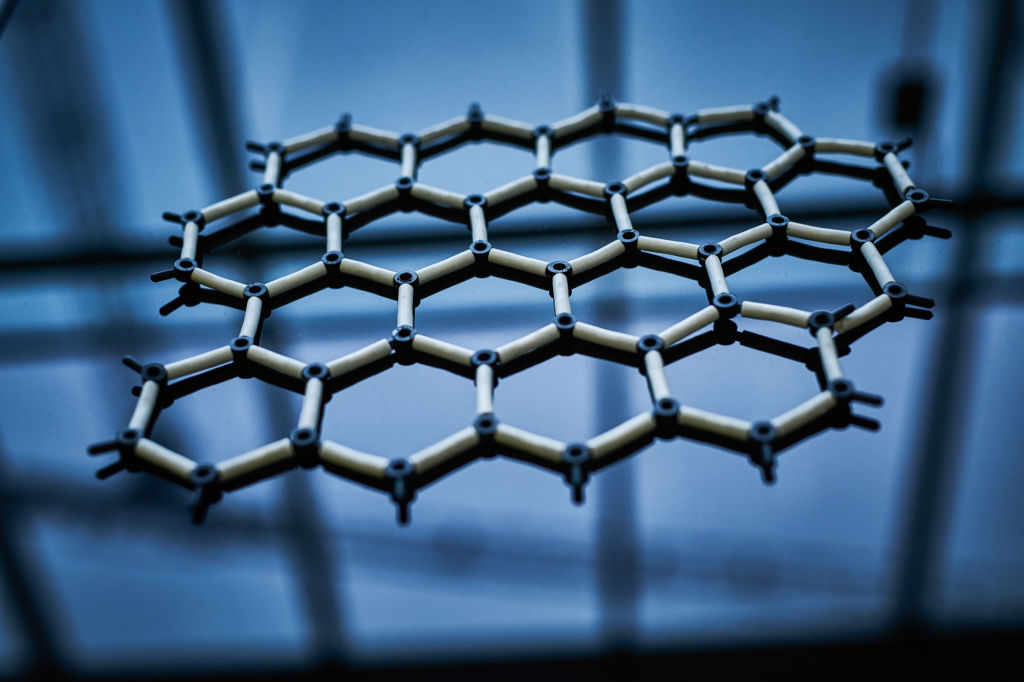A model showing the hexagonal structure of graphene sits on a bench in laboratory at the National Graphene Institute facility