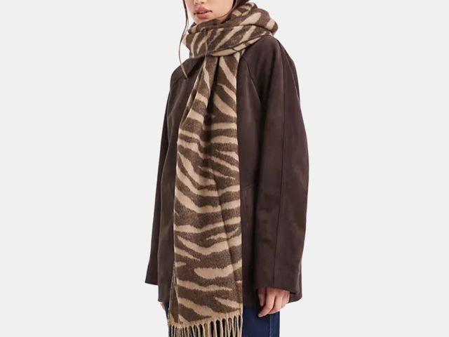 Image may contain: Clothing, Scarf, Coat, and Stole