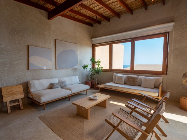 Image may contain: Coffee Table, Furniture, Table, Home Decor, Architecture, Building, Indoors, Living Room, Room, and Couch