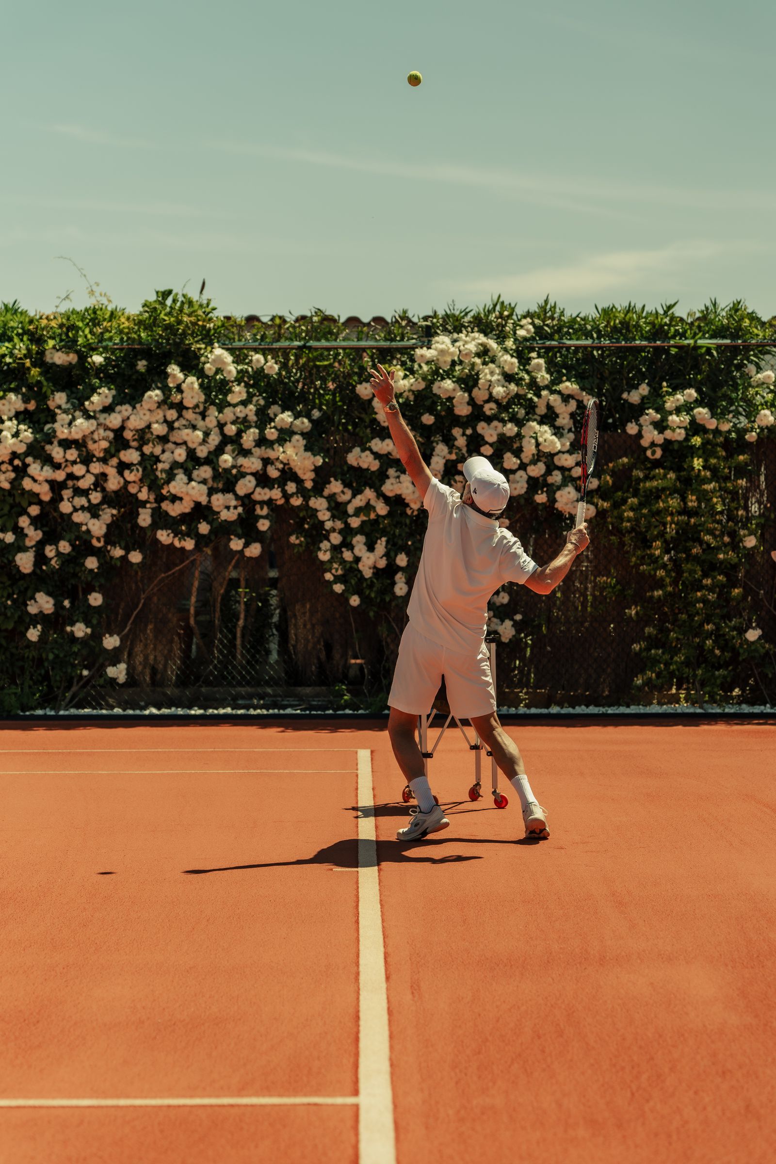 Image may contain Sport Tennis Adult Person Playing Tennis Racket Tennis Racket Ball and Volleyball