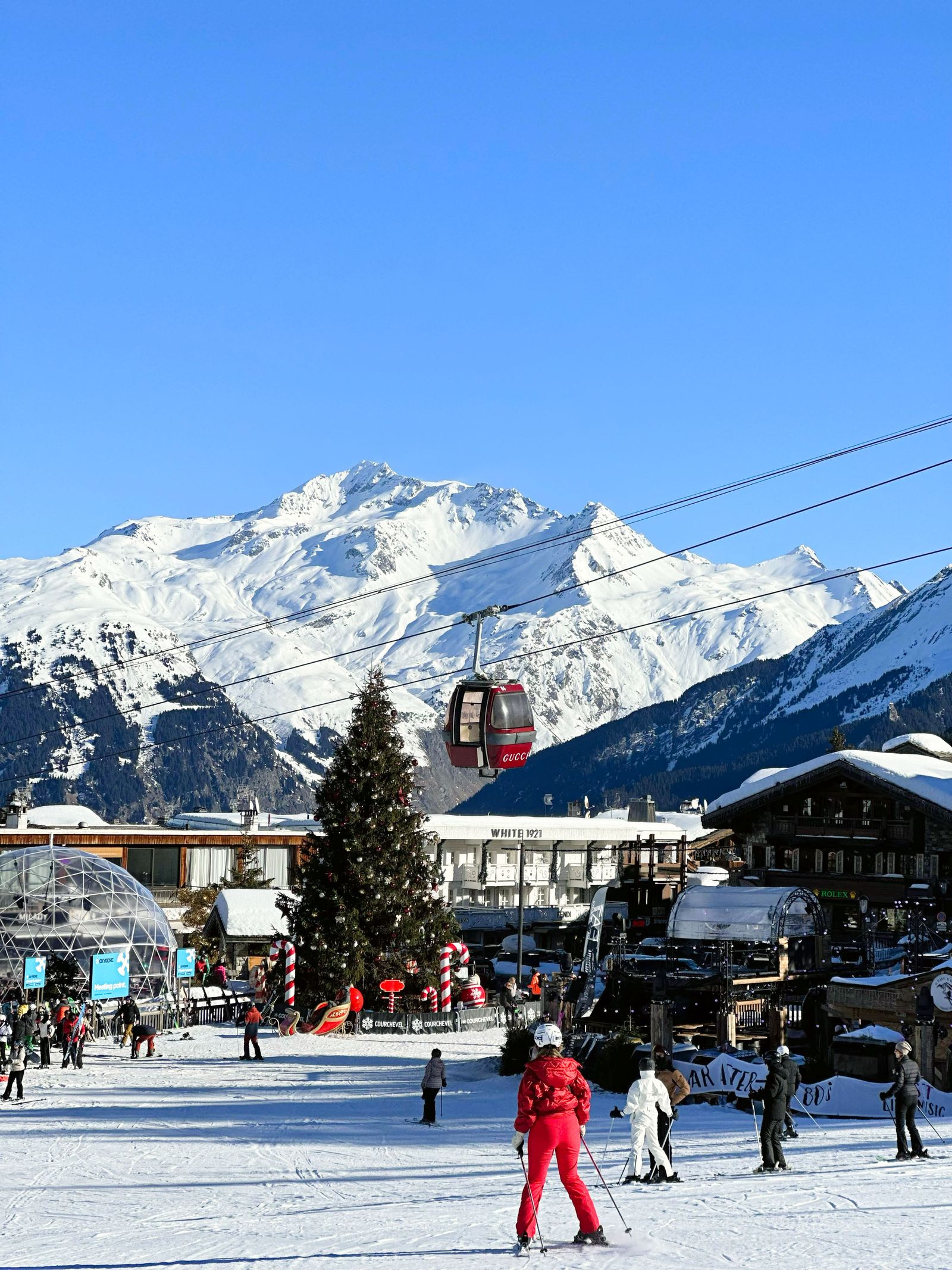 Image may contain Nature Outdoors Snow Adult Person Transportation Vehicle Clothing Footwear and Shoe