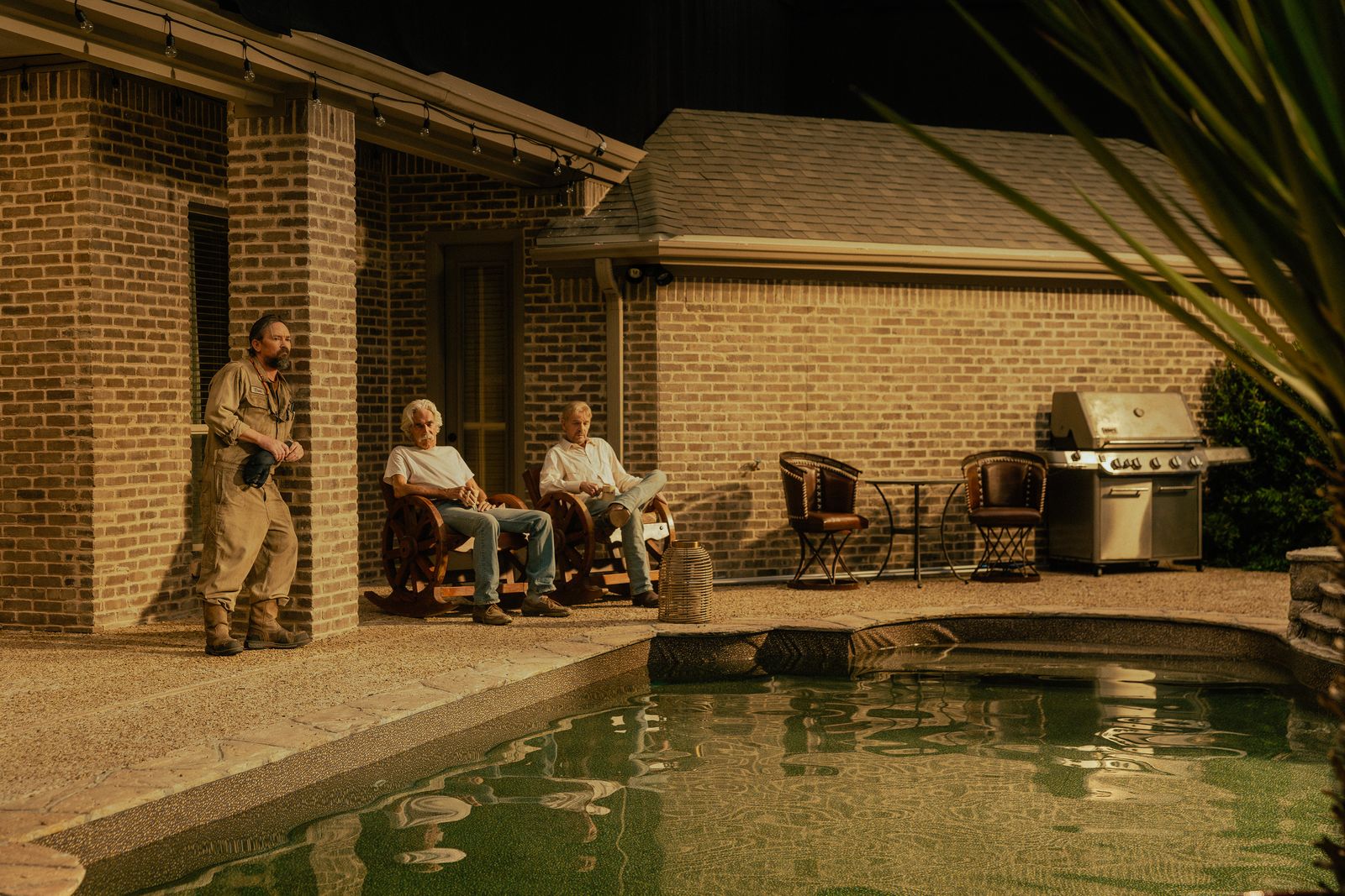 Image may contain Sam Elliott Brick Chair Furniture Adult Person Architecture Building Hotel Pool and Water