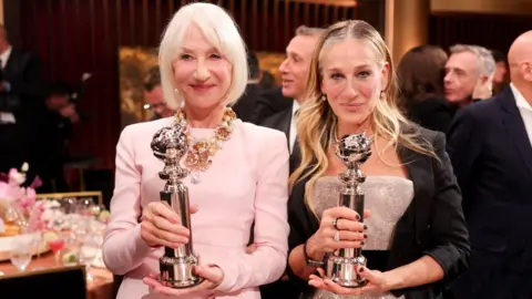 Getty Images Helen Mirren and Sarah Jessica Parker holding their Golden Globe Awards at the Golden Eve, held at The Beverly Hilton on January 06, 2026 in Beverly Hills, California.