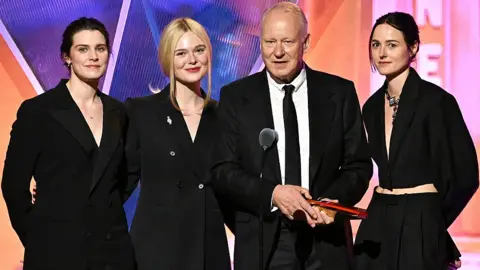 Getty Images Inga Ibsdotter Lilleaas, Elle Fanning, Stellan Skarsg&aring;rd, and Renate Reinsve accept Best Intergen/Foreign for "Sentimental Value" onstage during the 2026 Annual Movies for Grownups Awards with AARP at Beverly Wilshire, A Four Seasons Hotel on January 10, 2026 in Beverly Hills, California.