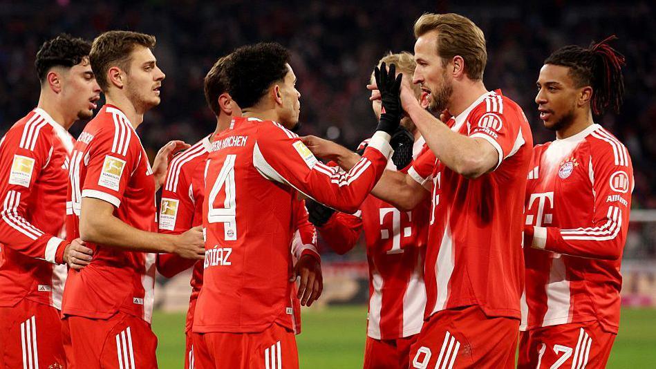 Bayern Munich players celebrate a goal during the 8-1 Bundesliga win against Wolfsburg