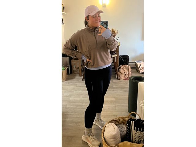 Image may contain: Clothing, Sleeve, Pants, Adult, Person, Footwear, Shoe, Hoodie, Knitwear, Sweater, and Sweatshirt