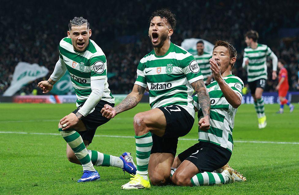 Sporting forward Luis Suarez (centre) celebrates opening the scoring against Paris St-Germain in the Champions League in Lisbon. Photo by Patricia De Melo Moreira