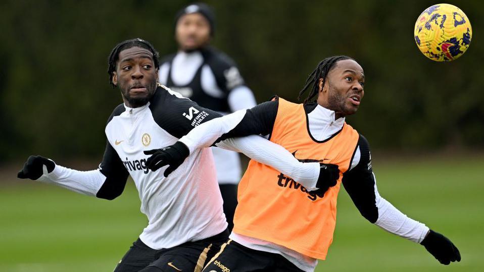 Axel Disasi and Raheem Sterling tussle for the ball