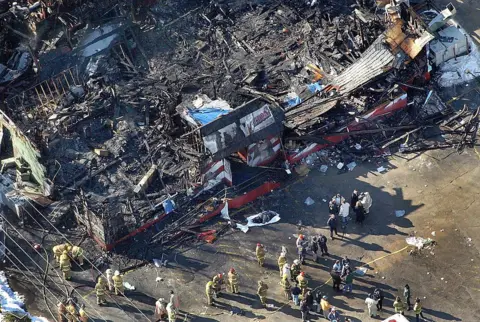 The Boston Globe/Getty Images Station nightclub fire scene, viewed from above. The building is shown burned to the ground with little left, after the flames were put out.