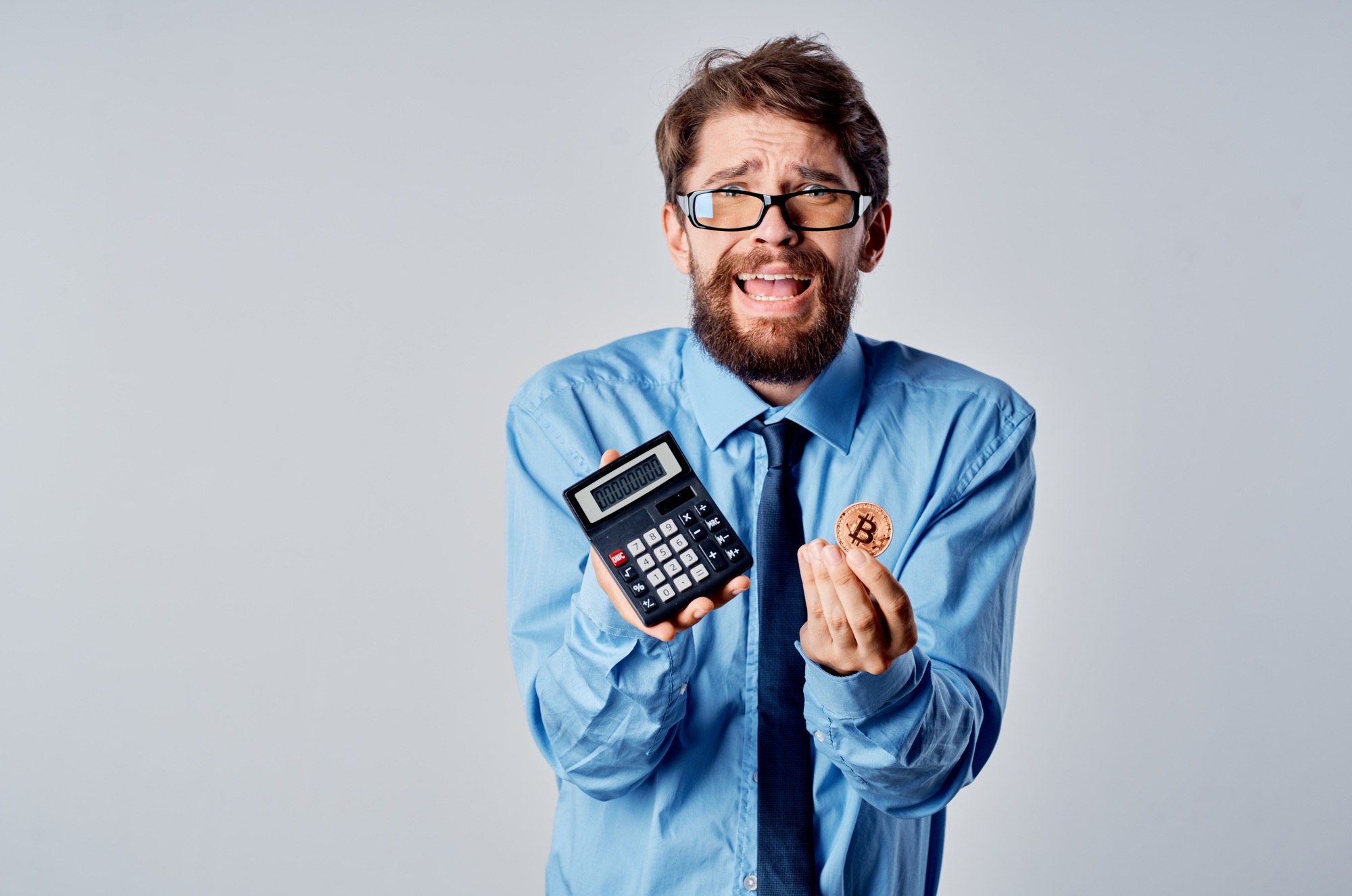 business man with calculator cryptocurrency bitcoin investment